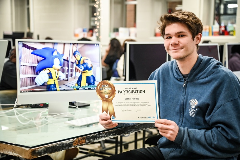 Gabriel Huntley, Paw Paw High School & Van Buren Tech Graphic Design student, wins Best of Show for his stop-motion animation video at the First Annual Kalamazoo Valley Community College Art and Design Competition Exhibit.