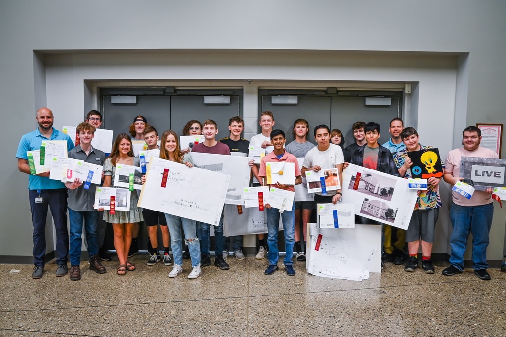 group photo of students holding ribbon